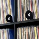 Close‑up detail photo of Classic A–Z Mid‑Century Modern vinyl record dividers showing matte black finish and letter cutouts