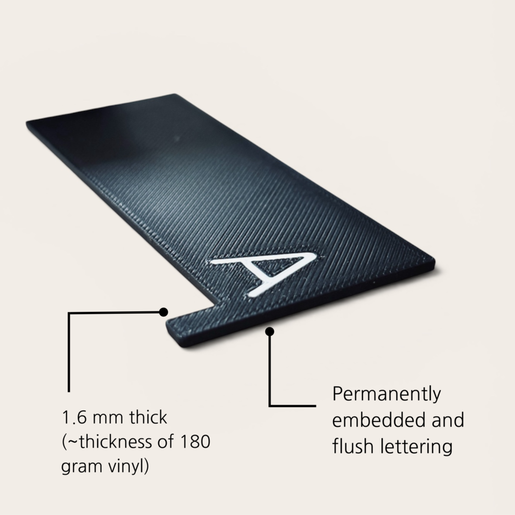 Black vinyl record divider showing 1.6 mm thickness and flush embedded letter A.