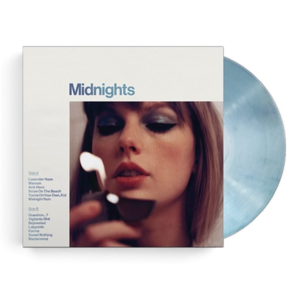 Taylor Swifts Midnights Moonstone Blue vinyl record displayed next to its album sleeve.