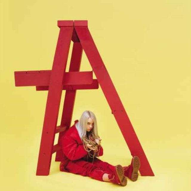 Billie Eilish sitting under a red frame on her Dont Smile at Me album cover.