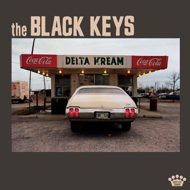 The Black Keys Delta Kream album cover featuring a vintage sedan outside a roadside stand.