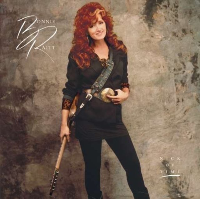 Bonnie Raitt holding a sunburst electric guitar on her Nick of Time album cover.