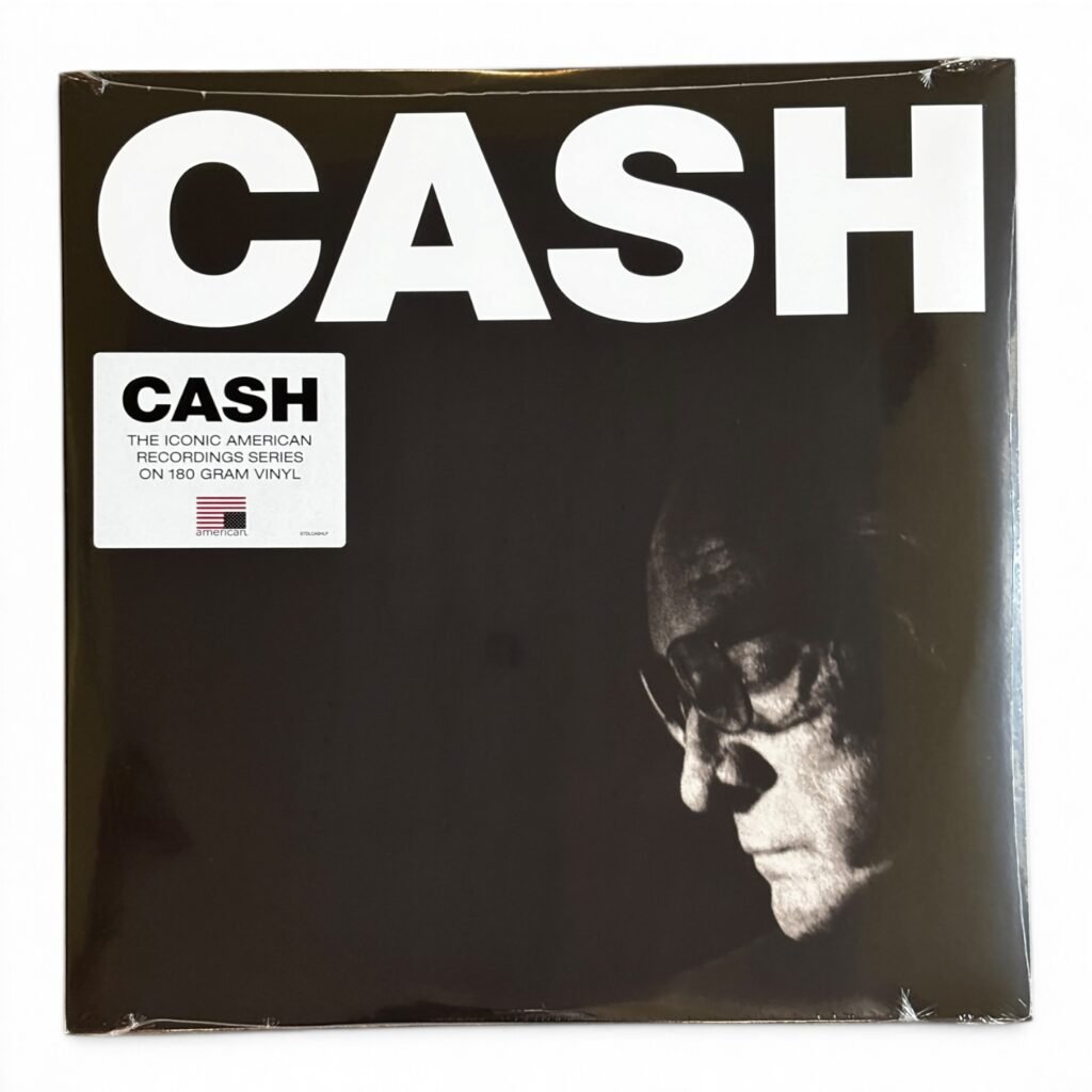 Johnny Cash vinyl record album cover featuring a dramatic black and white portrait.