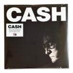 Johnny Cash vinyl record album cover featuring a dramatic black and white portrait.