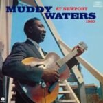 Muddy Waters at Newport 1960 album cover featuring the iconic blues musician playing guitar.