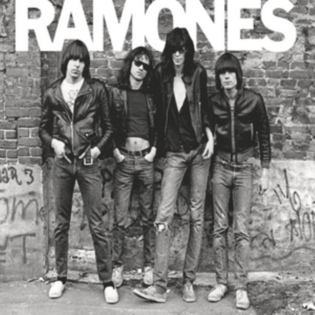 Black-and-white photograph of the Ramones punk rock band standing against a brick wall.