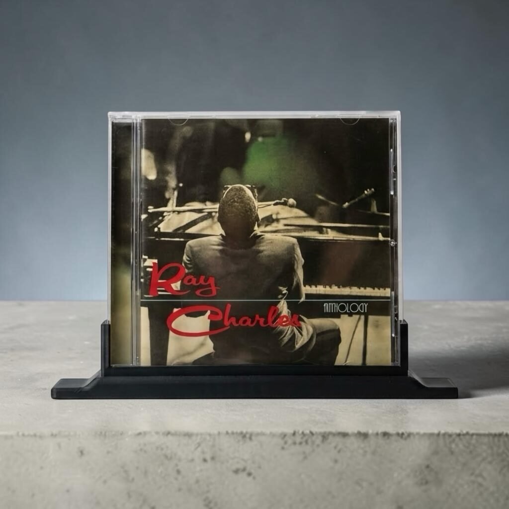 Ray Charles CD album in a clear jewel case on a black display stand.
