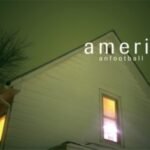 American Football self-titled album cover featuring a suburban house illuminated at night.
