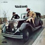 Crime Pays album cover featuring Willie Colón and Héctor Lavoe posed with a vintage car.