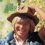 Album cover for John Denvers Greatest Hits featuring the artist smiling in a cowboy hat.