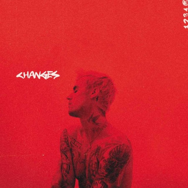 Justin Biebers Changes album cover featuring a red duotone profile portrait with tattoos.