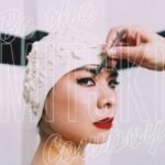 Mitskis Be the Cowboy album cover featuring a portrait in a retro swim cap.