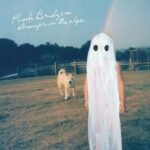 Phoebe Bridgers Stranger in the Alps album cover featuring a ghost figure and dog.