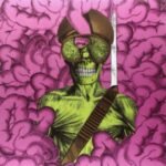 Psychedelic zombie skull illustration with goggles set against a pink brain background.