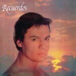 Vintage Recuerdos album cover featuring a portrait of a young man against a sunset.