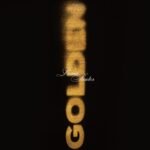 Romeo Santos Golden album cover featuring vertical gold lettering on a black background.