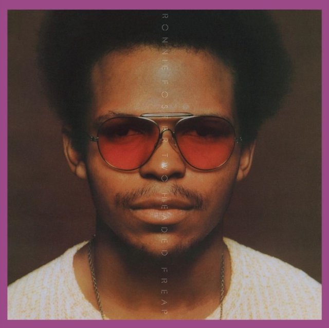Album cover for Ronnie Fosters Two Headed Freak featuring a portrait wearing red sunglasses.