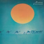 Santana Caravanserai album cover featuring a giant glowing sun and desert camel caravan.