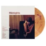 Taylor Swift Midnights vinyl album with sleeve cover and amber marble record.
