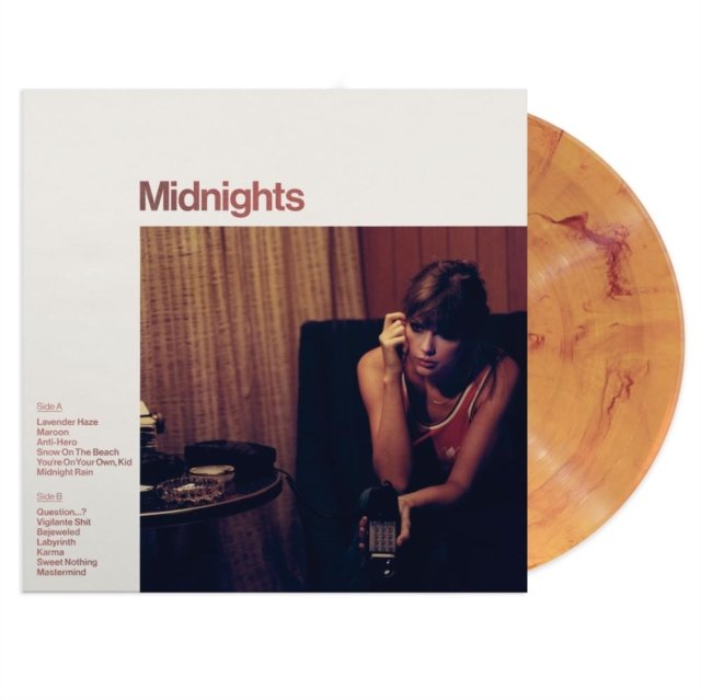 Taylor Swift Midnights vinyl album with sleeve cover and amber marble record.